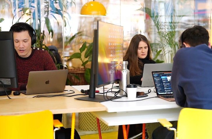 The Houst guest team at their desks