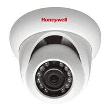 Caméra de sécurité Honeywell blanche avec LED infrarouges, fixée au plafond.