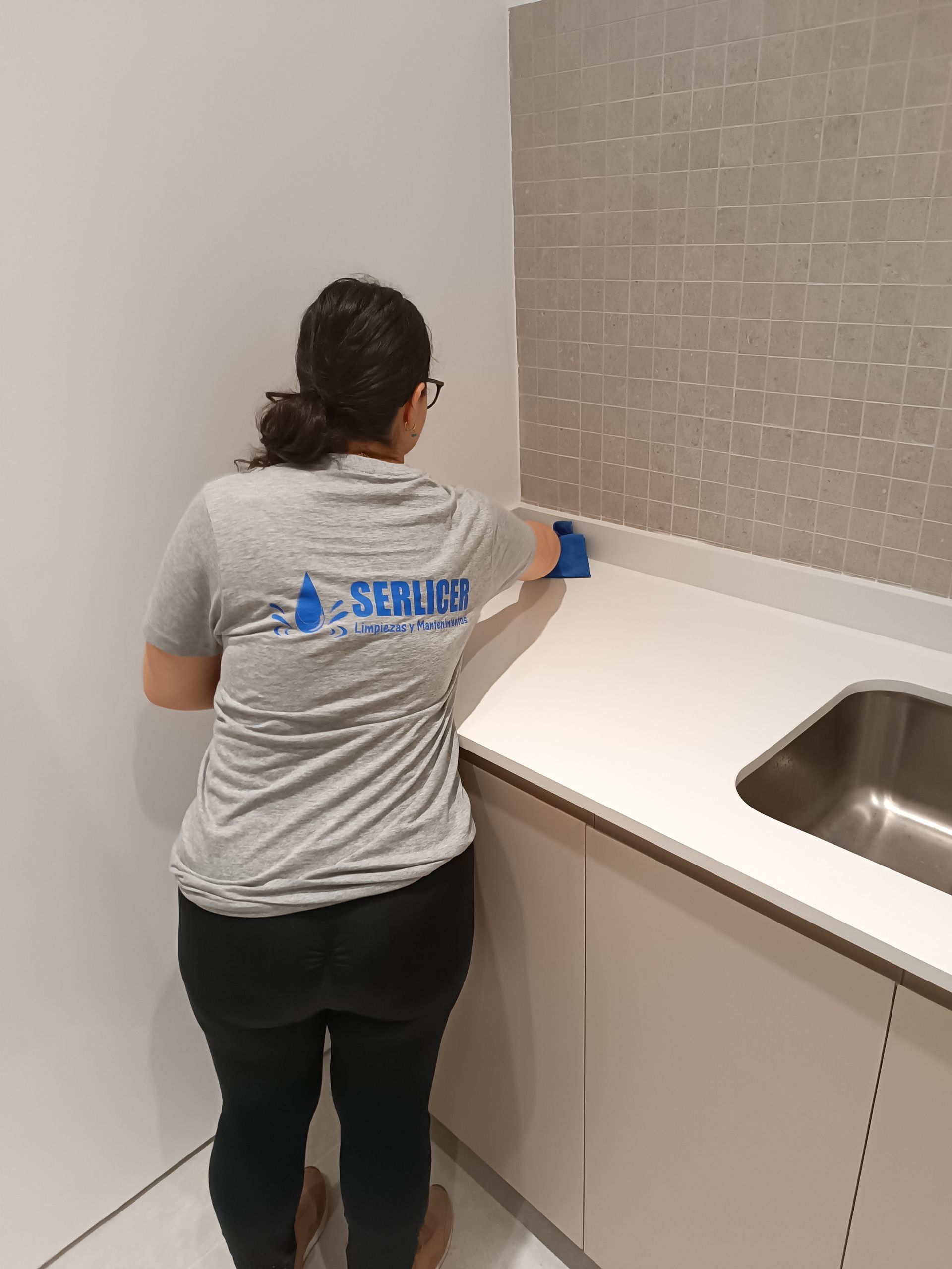 Realistic stock image of professionals cleaning office.
