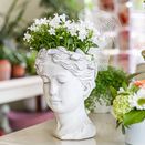 Kopfvase mit Blumen