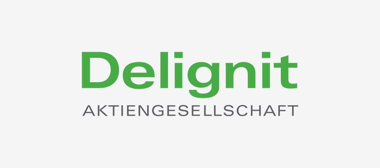 Firmenlogo von Delignit mit grünem Text, „Delignit“ darüber „AKTIENGESELLSCHAFT“ in Grau auf hellgrauem Hintergrund.