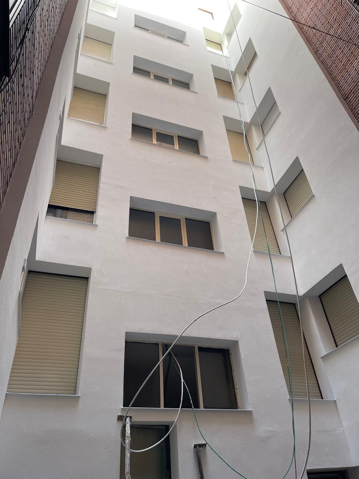 Rehabilitaciones Mendi Bilbao fachada amarilla