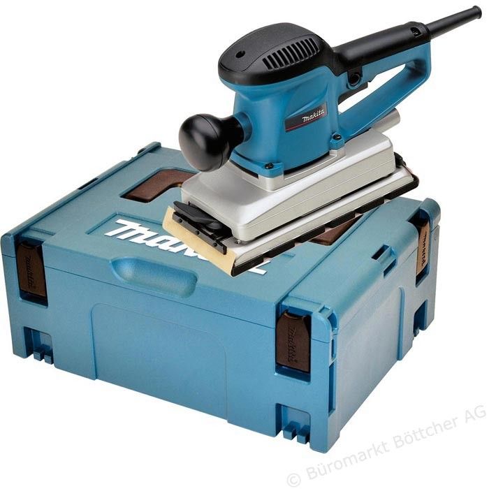 Una levigatrice Makita è appoggiata sopra una scatola blu