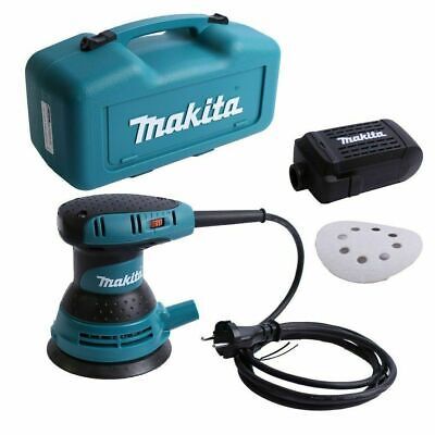 Una levigatrice Makita è seduta accanto a una custodia Makita