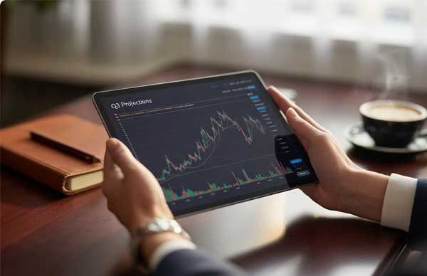 Person reviewing a financial chart on a tablet