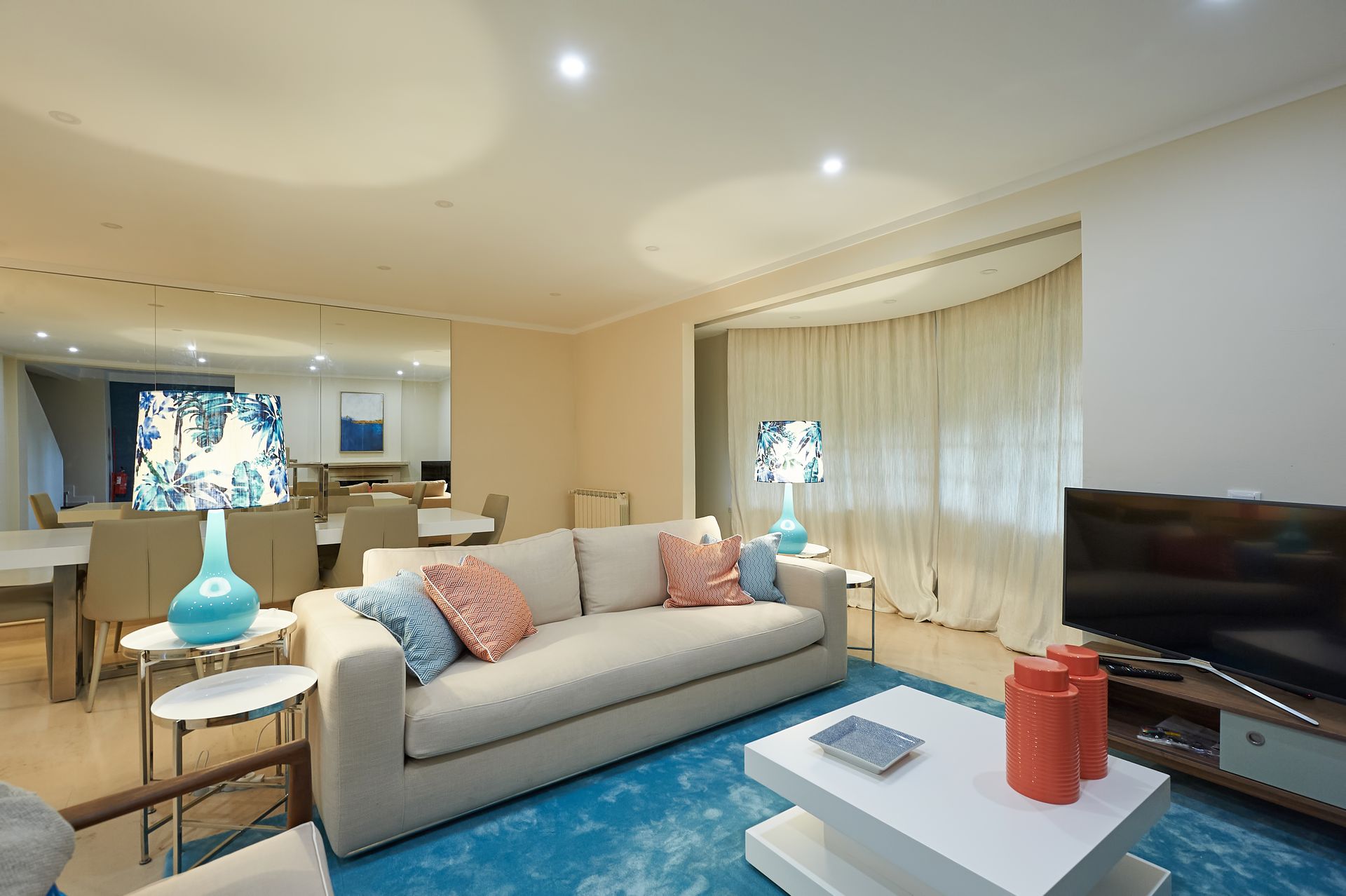 A living room with a couch and a flat screen tv