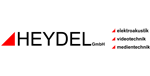 HEYDEL-Logo mit rotem Dreieck und schwarzer Schrift; kleine Liste der Dienstleistungen rechts auf weißem Hintergrund