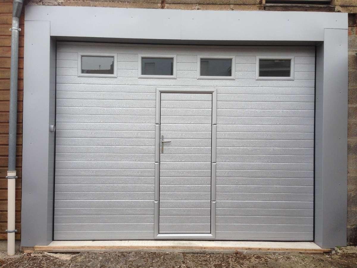 porte sectionnelle avec portillon , ste des ateliers blanzynois 71450