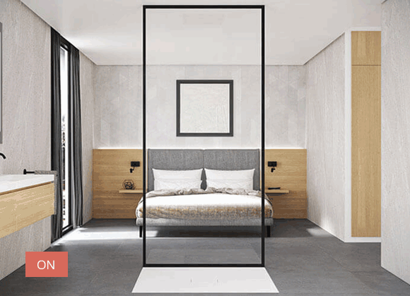 Un dormitorio moderno con una cama centrada frente a una cabina de ducha; la ducha tiene un botón de