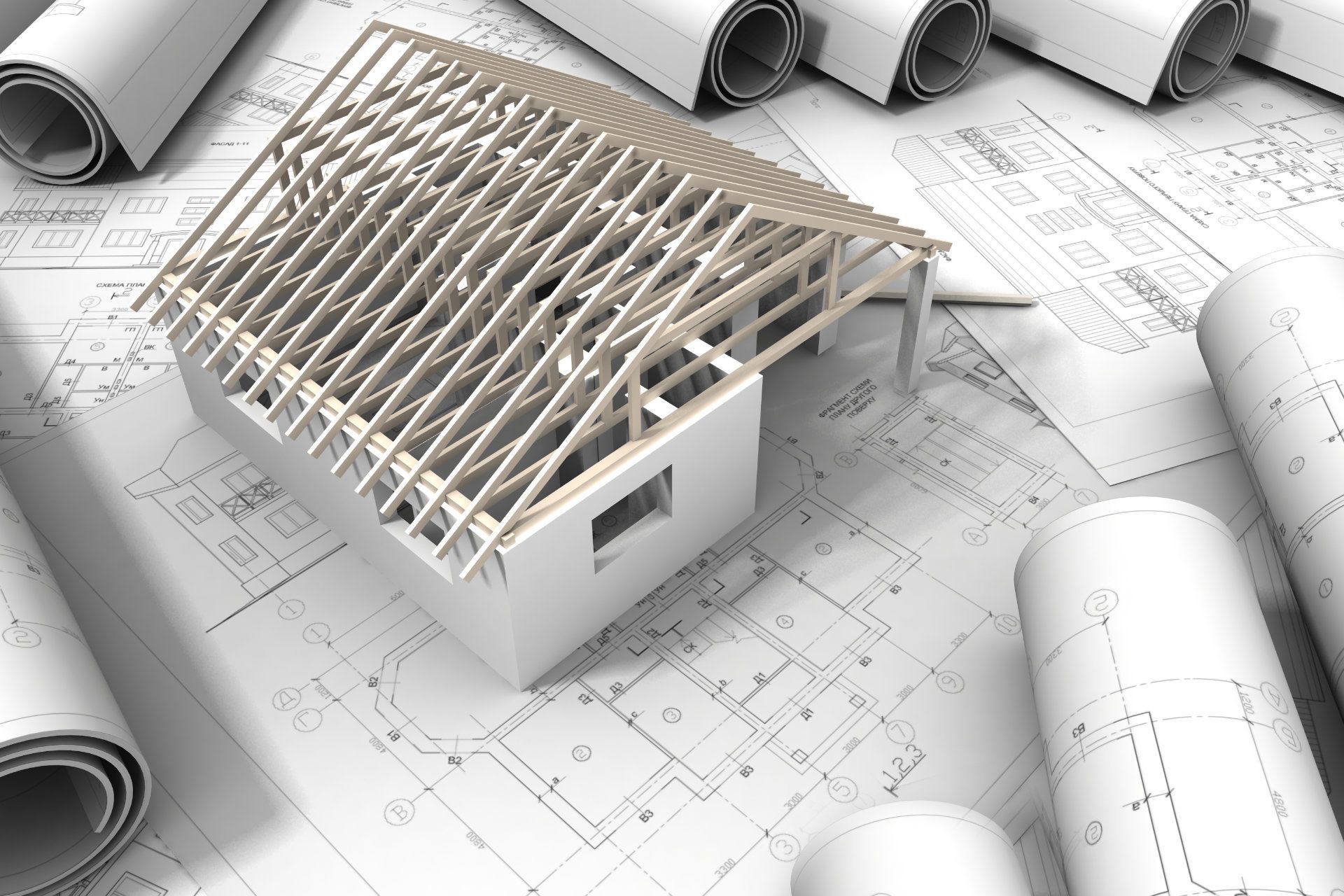 Betonfüße mit Stahlträgern stehen auf technischen Zeichnungen