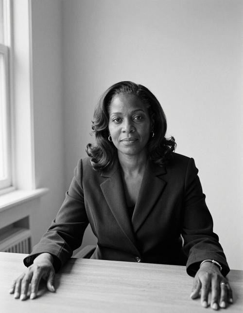 Adaeze Okafor, partner, seated at a desk