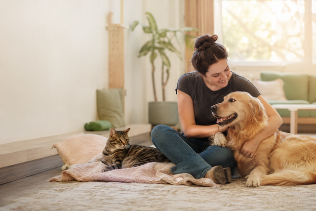 Happy Tails founder with dogs and cats in her care