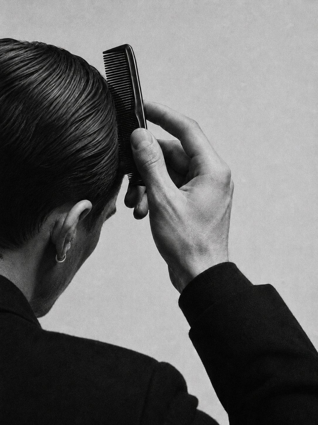 Barber combing a client's hair into shape
